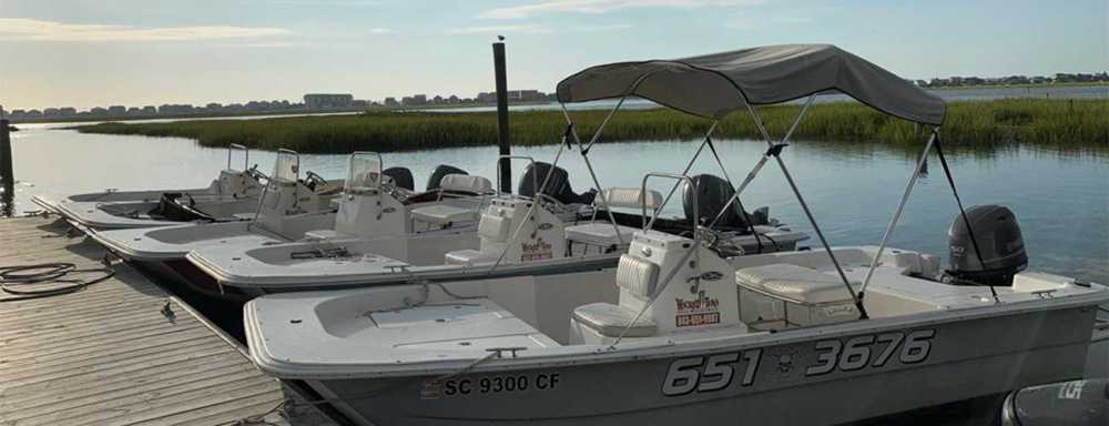 a boat is docked next to a body of water