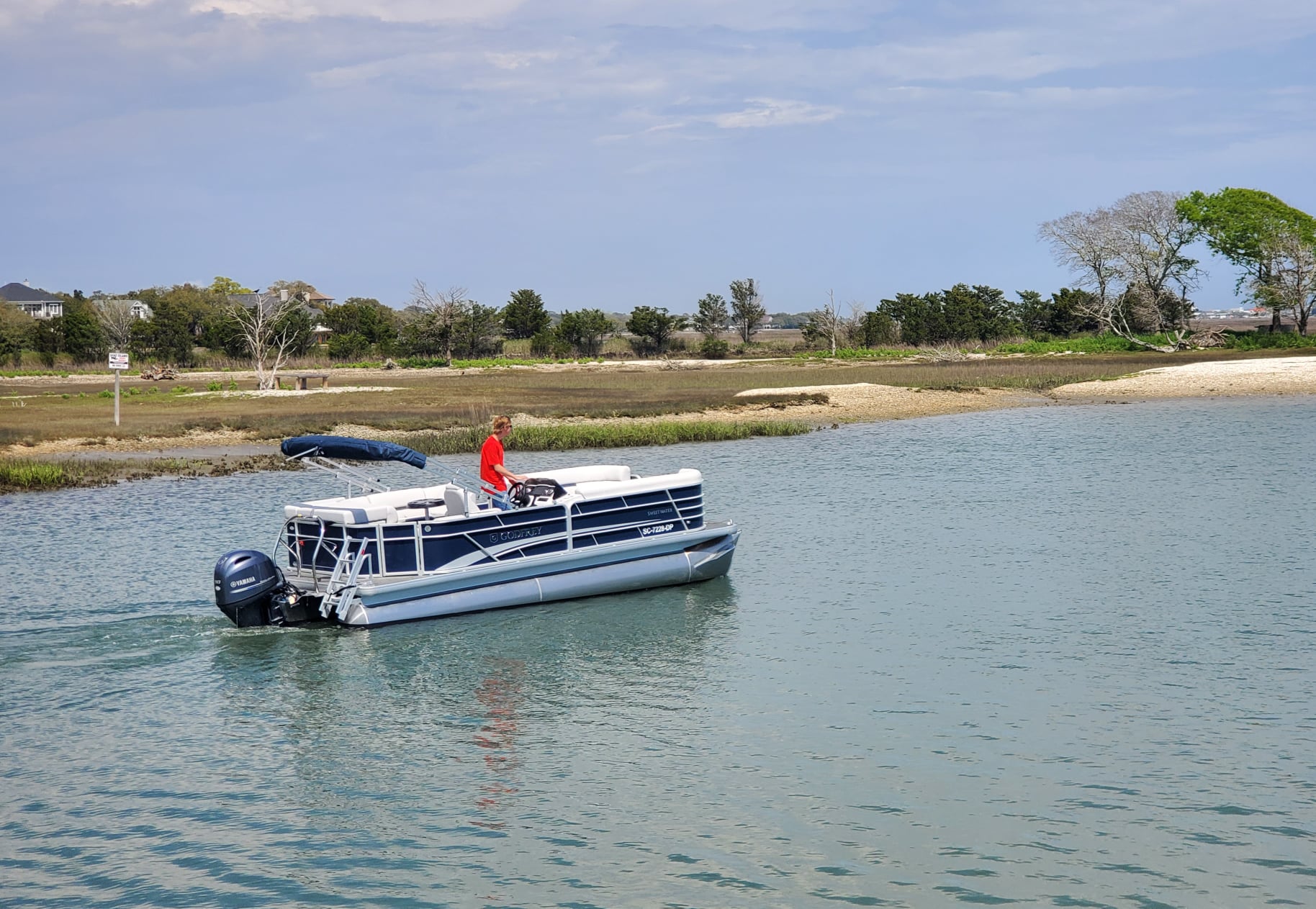 a small boat in a body of water a small boat in a body of water