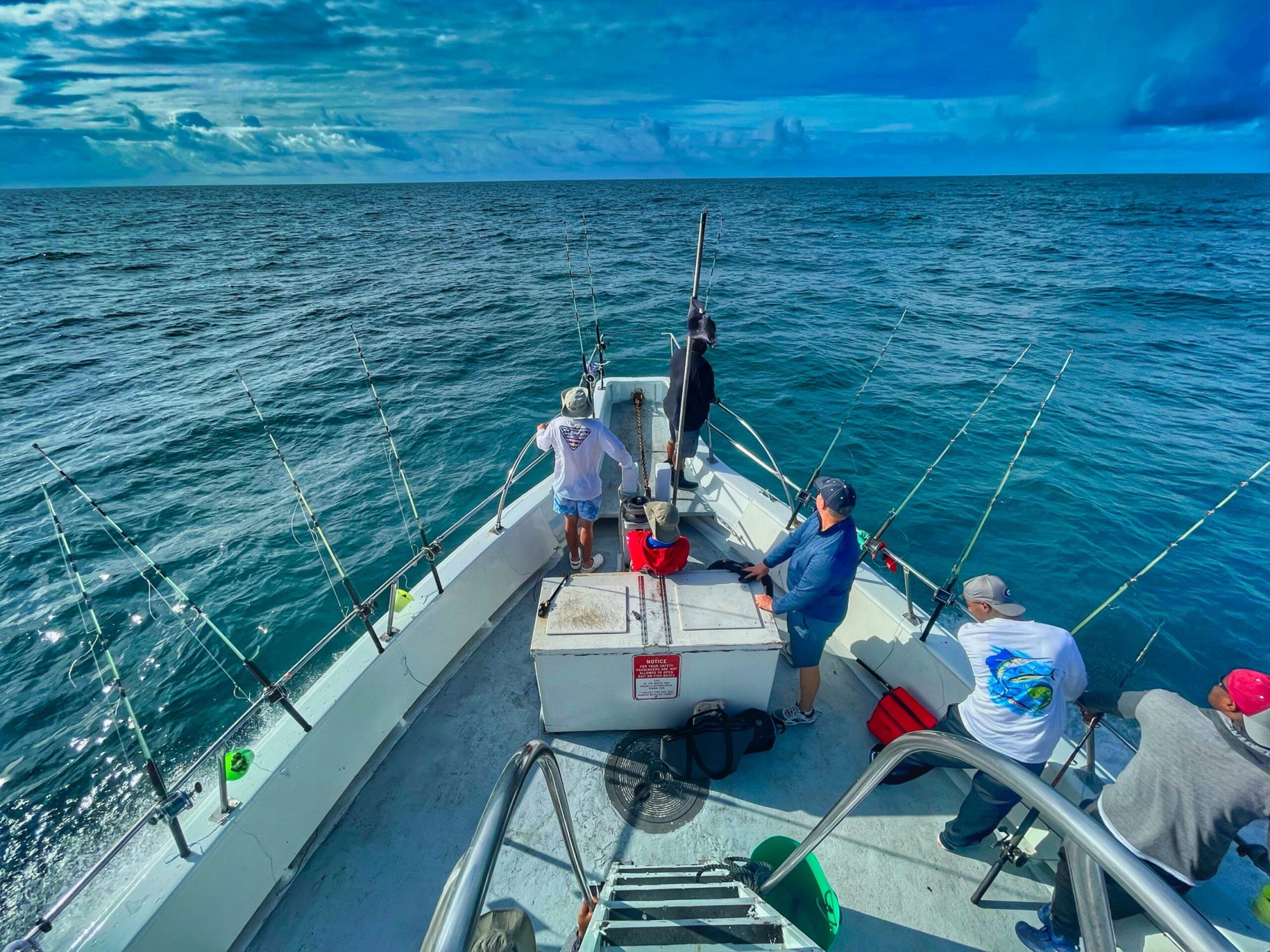 What to Expect from Your Deep Sea Fishing Trip in Myrtle Beach a group of people on a boat in the water