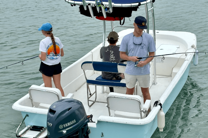 a group of people on a boat in the water