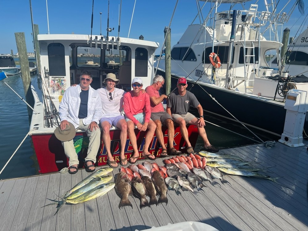 a group of people standing on a boat