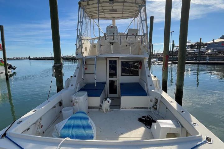 a close up of a boat next to a body of water