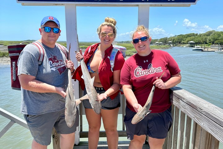 a group of people holding a sign