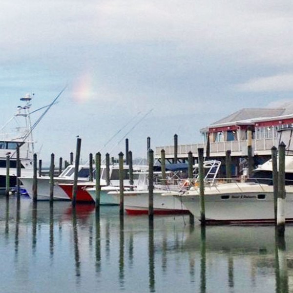 a boat is docked next to a body of water