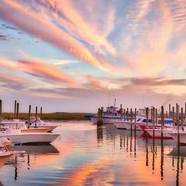 a boat is docked next to a body of water