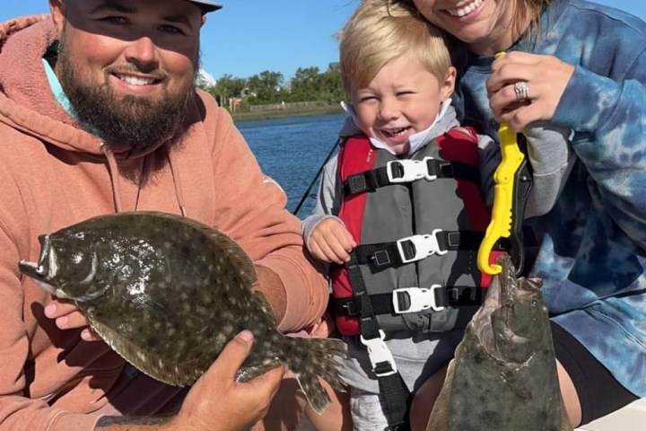 a group of people holding wine glasses