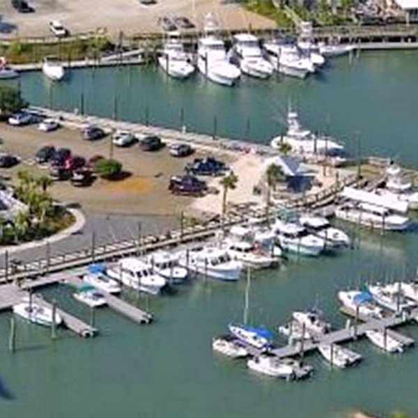 a boat is docked next to a body of water