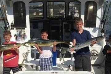 a person holding a fish