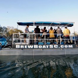 a group of people on a boat in the water