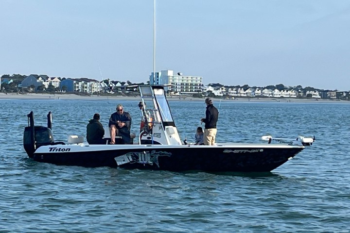 a group of people on a boat in the water