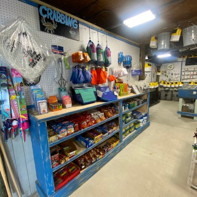 a group of people performing on a counter in a store