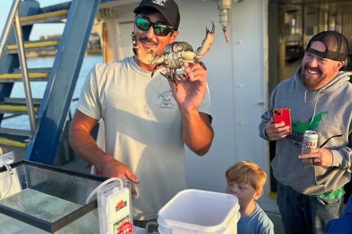 a group of people riding on the back of a truck