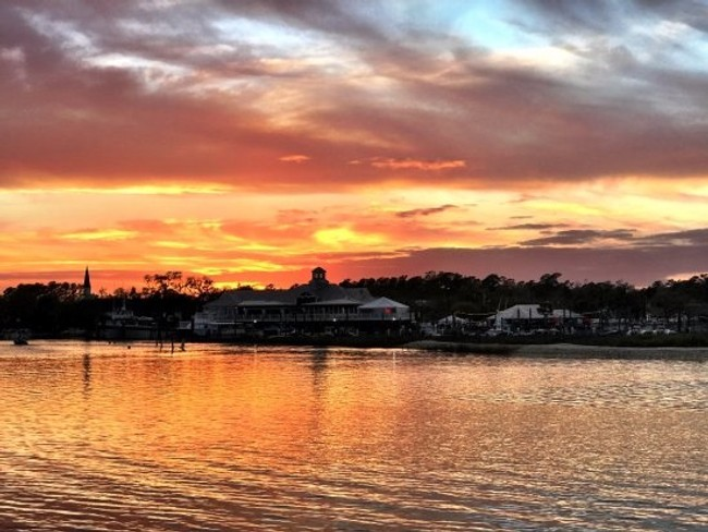 Inlet Sunset Cruise Image 3 a sunset over a body of water