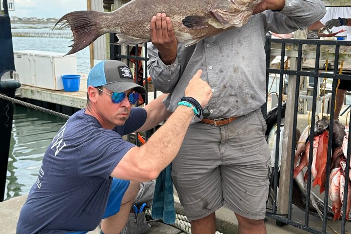 a group of people standing in front of a building