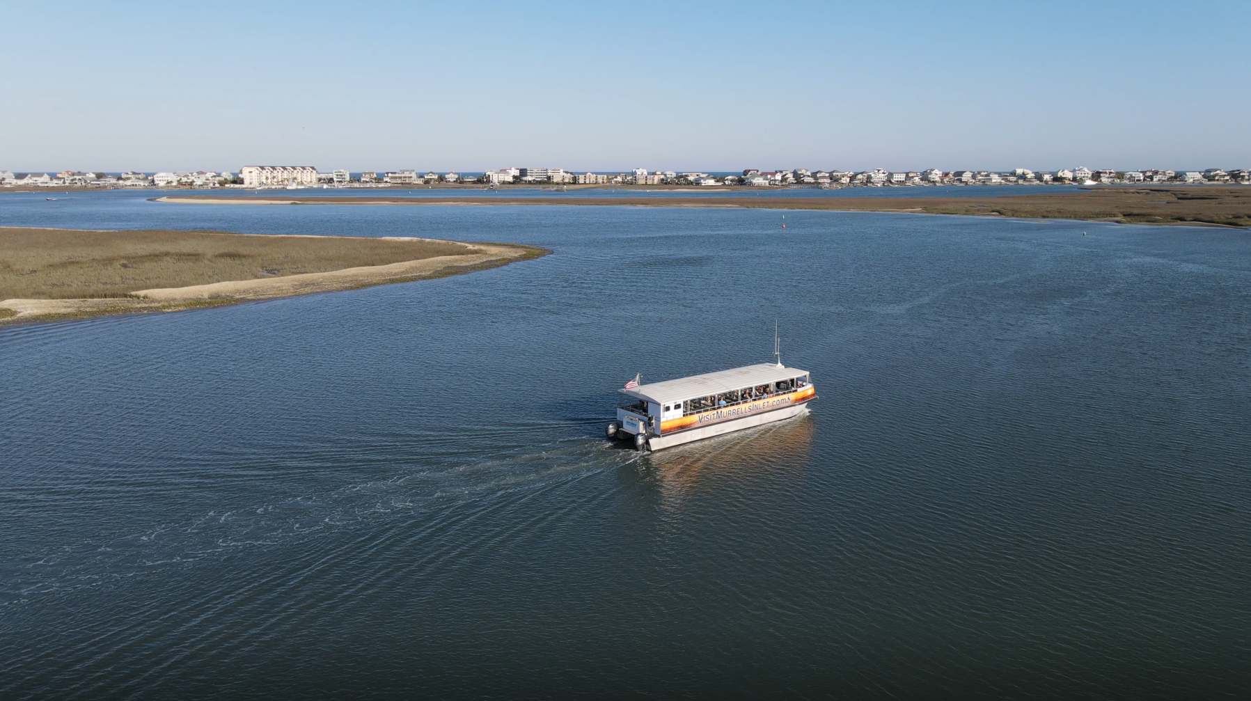 Inlet Bird Watching Tour Image 1 a small boat in a body of water
