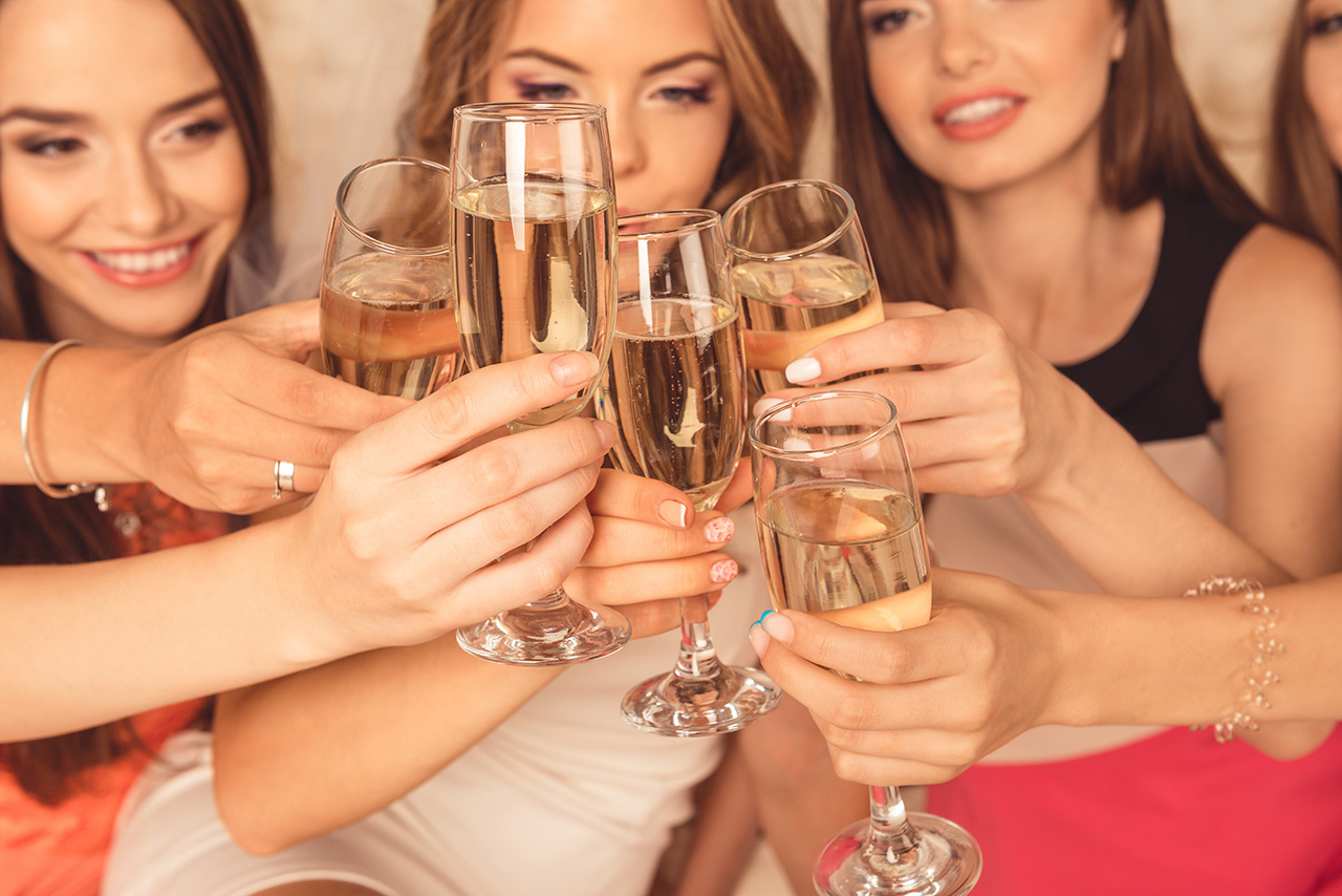 Close up photo of girls celebrating a bachelorette party and cli Close up photo of girls celebrating a bachelorette party and cli