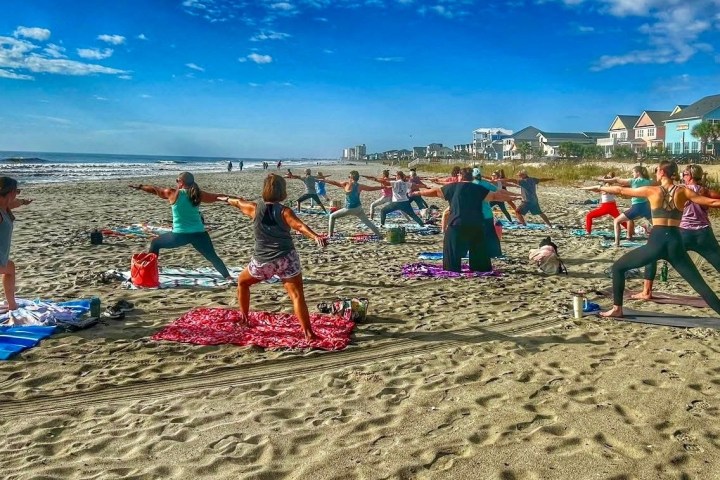 a group of people on a beach