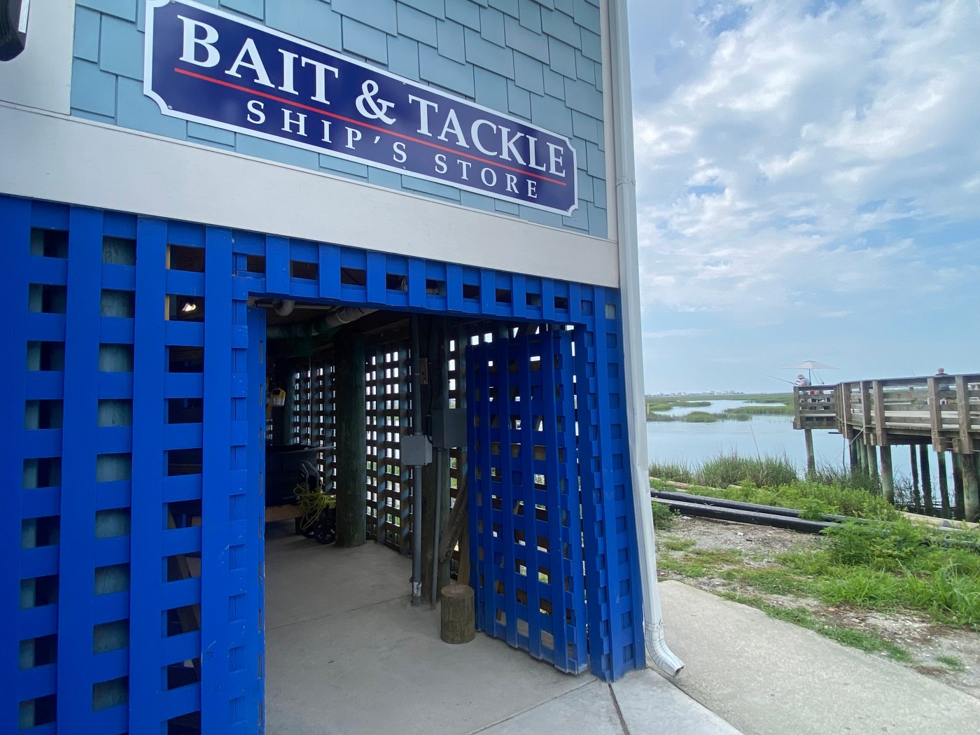 Crazy Sister Marina Fishing & Cruises bait & Tackle Shop a sign on the side of a building