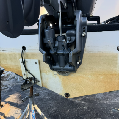 Close-up of a boat motor on a stand at Murrells Inlet, April 30, 2025, 8:07 AM.